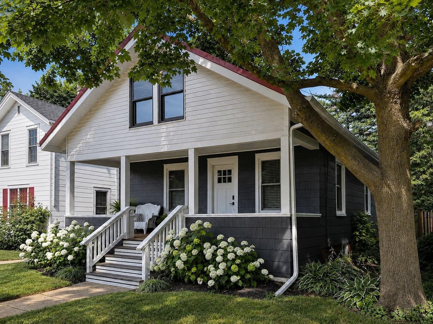 front view of blue and white bungalow style house with front porch
