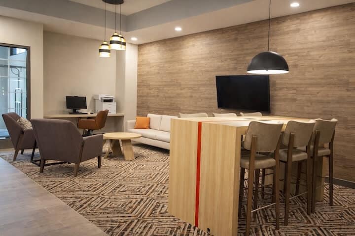 candlewood-suites-clarksville-9099110130-69kb Modern lounge with seating and workstations